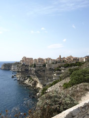 Fototapeta na wymiar Bonifacio, Corsica, France - August 30 2013: the city of Bonifacio on the cliff
