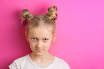 little girl blonde on a pink background