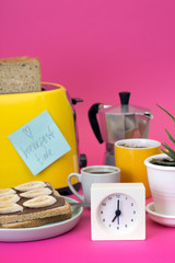 yellow toaster on a pink background