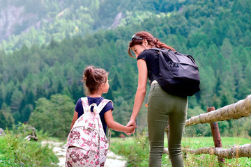 mother and childclimbing mountain and looking for adventure