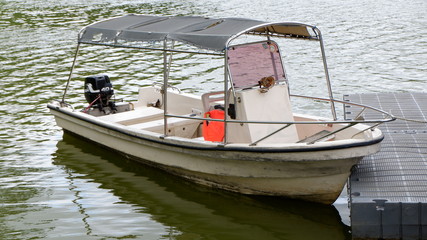 fishing boats anchored on the dock await tide sea water