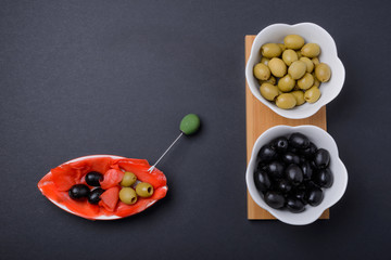 olives and black olives in a bowl and ginger