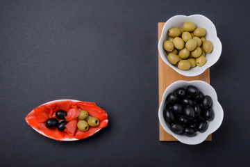 olives and black olives in a bowl and ginger