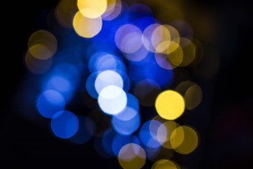Obraz premium Colorful, dark background with bokeh effect. Cold bokeh circles
