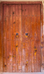 Old grunge door in a castle backyard