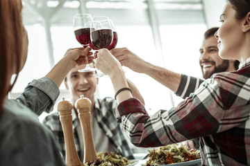 Positive delighted young people celebrating their success