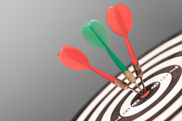 Dartboard with dart in center. Concept of target in business and success
