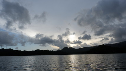 the view of the reddish blue sky at the lake at sunset