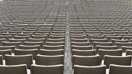 Grey empty seats at the stadium.