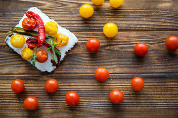 Fresh sandwich with cherry tomatoes and grilled cherries, close up. Yellow and red cherries. Free space for text, copy space. 