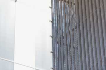 Corrugated aluminum. Finish exterior facades aluminum. Shopping center. Bulbs for night lighting. Metal panels for cladding. Ventilated facade. Yellow aluminum panel.