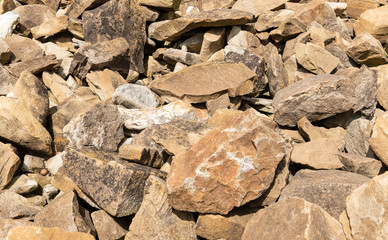 Pile of medieval stones or rocks  of irregular sizes.