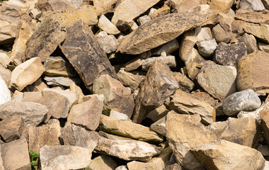 Pile of medieval stones or rocks  of irregular sizes.