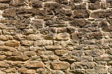 Medieval Stone Wall Texture. Old brick and stone wall with thick grout and very rough, irregular surface.