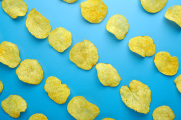 Potato chips pattern on pastel blue background top view flat lay