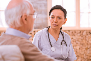 Attentive young woman listening to her patient