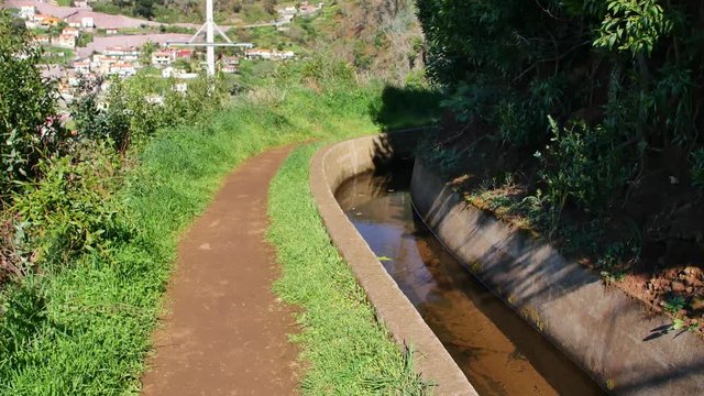 Levada  dos Tornos, Madeira. Beautiful footpath in spring sunlight.