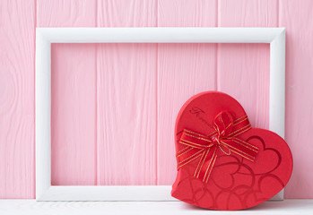 Valentine's Day. Background for Valentine's Day. Pink board. Box for presents. 