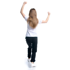 Woman in black sweatpants and white t-shirt hands up happy dance winning on white background isolation, back view