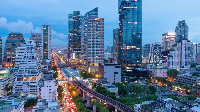 Timelapse day to night cityscape view of modern building in business area town at Bangkok in Thailand