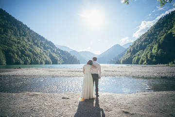 couple in mountains lake
