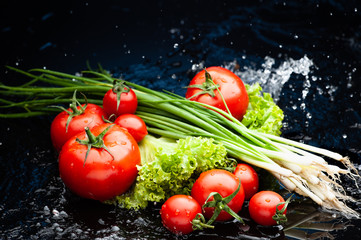 Studio shot with freeze motion of  vegetables in water splash