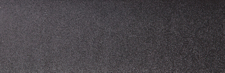 Silver sequins pattern. Sparkling sequins on black wool fabric as background