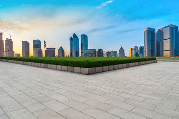 Empty Plaza Floor Bricks and the Skyline of Modern Urban Architecture in Qingdao..