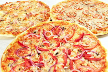3 different pizza set for menu. pizza four cheese, margarita, vegetarian pizza with mushrooms, pizza with ham