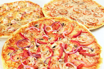 3 different pizza set for menu. pizza four cheese, margarita, vegetarian pizza with mushrooms, pizza with ham