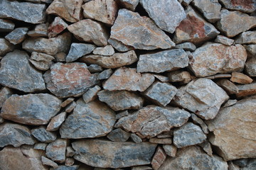 wall of stones of different sizes, background