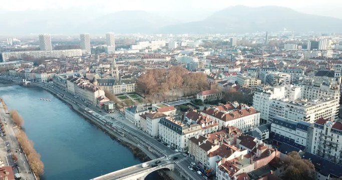 Aerial view Grenoble of city center with embankment of Isere river, France