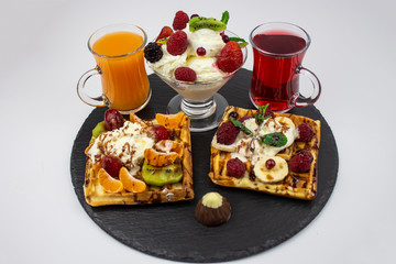 Colorful menu. waffles, ice cream, juice and berries. The concept of tasty food. copy space