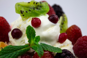 Closeup of ice cream with berries and mint. isolate