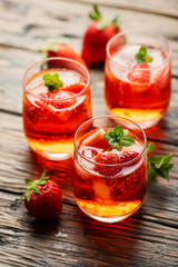 Fresh summer cocktail with ice, strawberry and mint