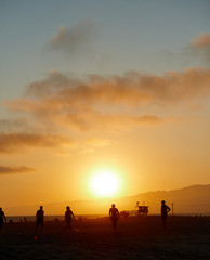 People on Los Angeles Santa Monica beach during sunset