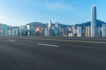 Road and skyline of modern urban architecture in Hong Kong..