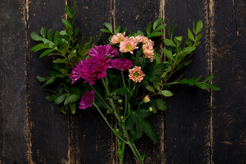 Flower business - a bouquet on a wooden background