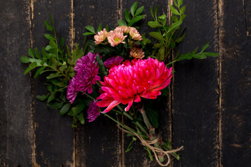 A bouquet of beautiful flowers for the holiday on a wooden background