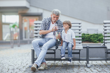 Grandfather with a grandson on a walk