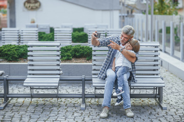 Grandfather with a grandson on a walk