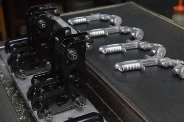 Obraz na płótnie Canvas Preparation of parts of airbrush and spray gun for CNC lathe machining.