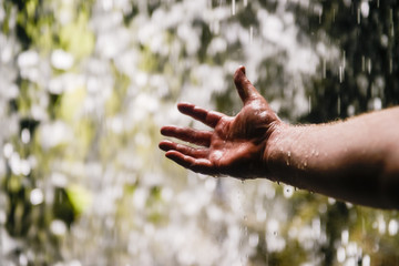 hand in waterfall