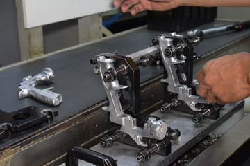 Fototapeta na wymiar Preparation of parts of airbrush and spray gun for CNC lathe machining.
