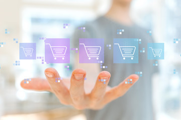 Online shopping theme with young man holding his hand