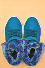 Stylish shoes on yellow background with glitch effect.