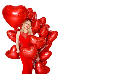 Beautiful smiling blond woman posing and holding red balloons heart. Valentine's day. isolated on white