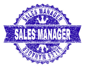 SALES MANAGER rosette seal overlay with grunge style. Designed with round rosette, ribbon and small crowns. Blue vector rubber print of SALES MANAGER label with grunge style.