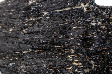 Macro mineral stone Schorl, Black Tourmaline on a white background
