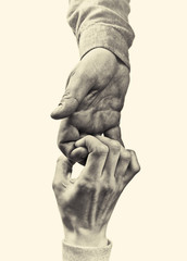 A firm handshake between two partners. Black and white image on isolated background.